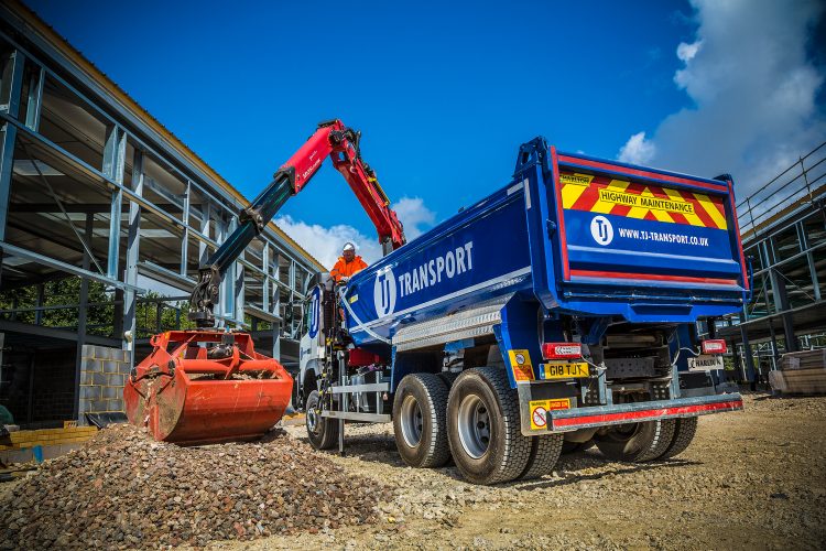 TJ Transport grab lorry grabbing gravel and building materials