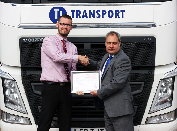 AWARD: TJ’s transport director, Neil Glazebrook, left, receives the accolade from Mark Fennell, CEMEX’s commercial haulage capacity manager for the South. Haulage specialst TJ won the national award for leading the way with a cycle safe campaign.
