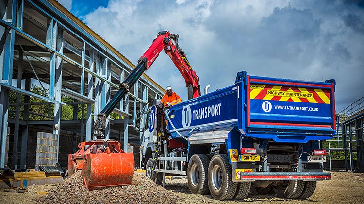 TJ Transport grab lorry grabbing gravel and building materials